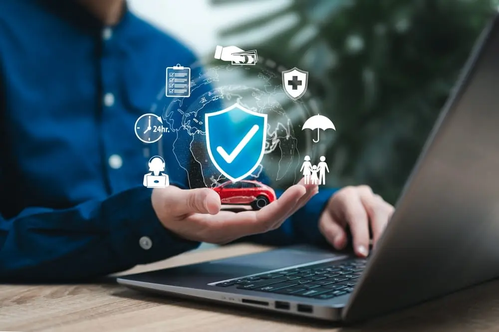 Property manager reviewing HOA insurance compliance documents and policies